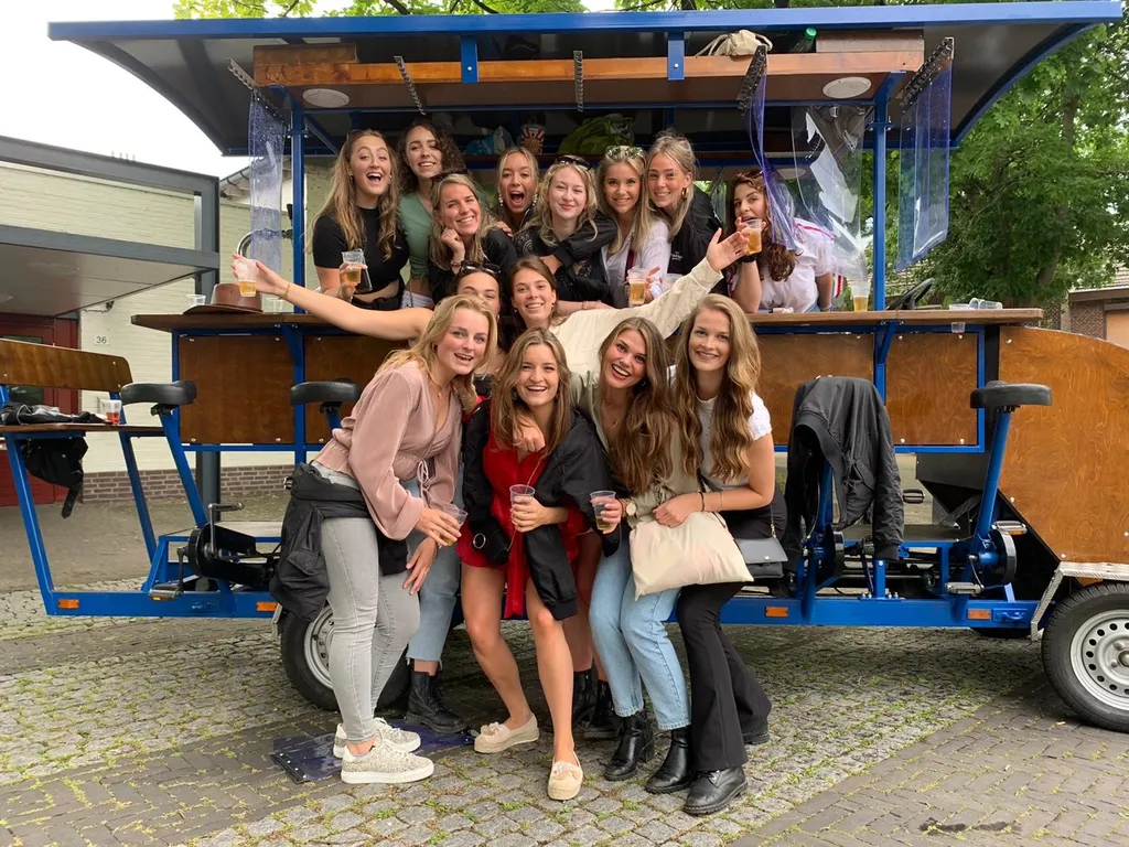 Group posing with beer bike in Utrecht