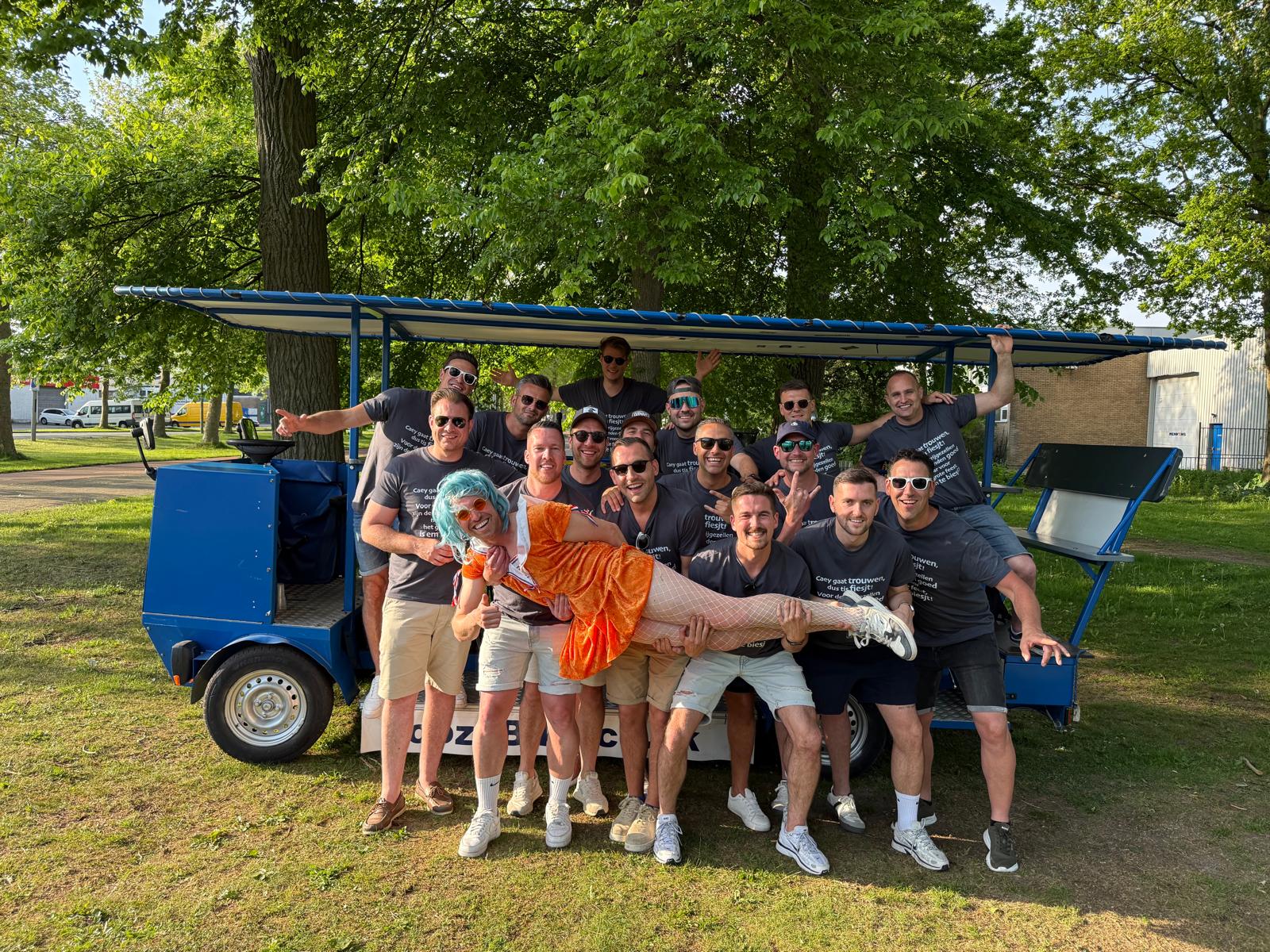 Stag do group celebrating with beer bike